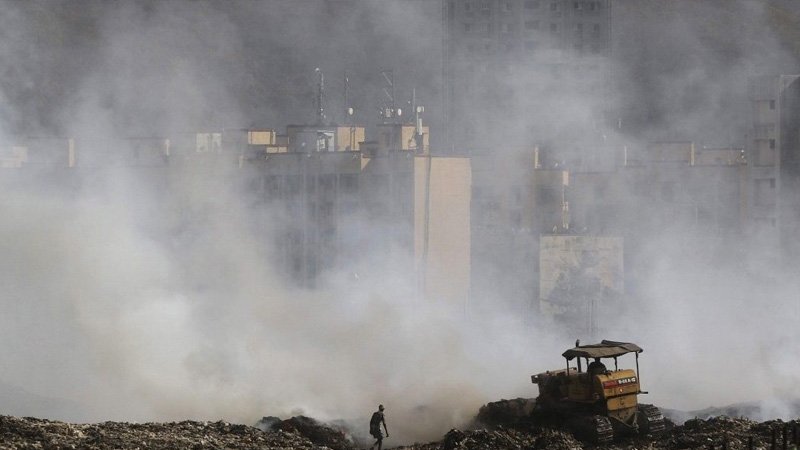 The Looming Shadow of a Mountain of Garbage Which Spells Danger and Also Livelihood for its Dependants